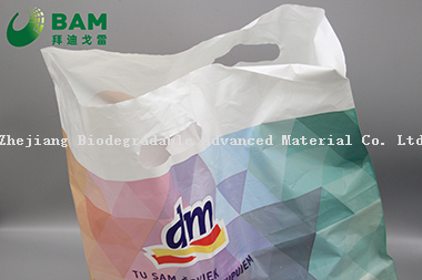 Sustainable Packing Biodegradable Plastic Carrier Punch Hole Handle Bags Supermarket Shopping T-Shirt Bags for Vegetables Fruit Gift Garment Bags